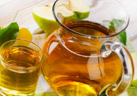 Apple juice and apples on wooden table. Selective focusの写真素材