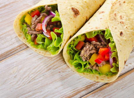 tortilla wraps with meat and vegetables. Selective focusの写真素材