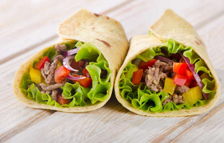 tortilla wraps with meat and vegetables. Selective focusの写真素材