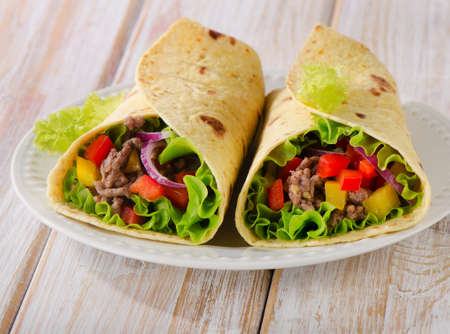tortilla wraps with meat and vegetables. Selective focusの写真素材