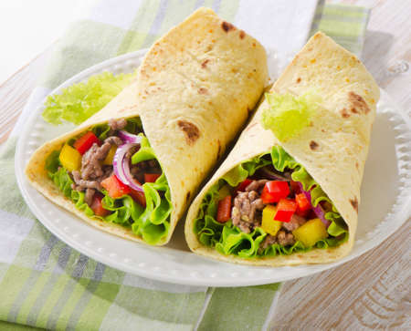 tortilla wraps with meat and vegetables. Selective focusの写真素材