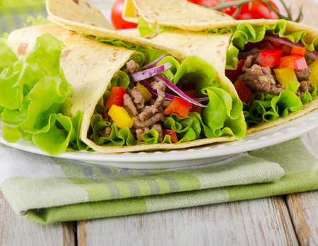 tortilla wraps with meat and vegetables. Selective focusの写真素材