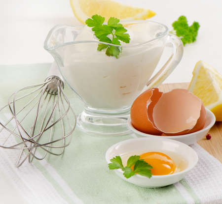 Fresh mayonnaise and ingredients with herbs. Selective focusの写真素材