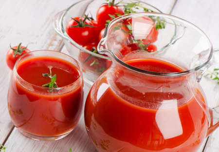 Tomato juice with fresh herbs . Selective focusの写真素材