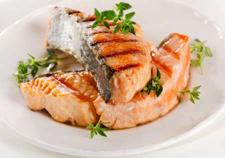 Grilled salmon with fresh herbs. Selective focusの写真素材
