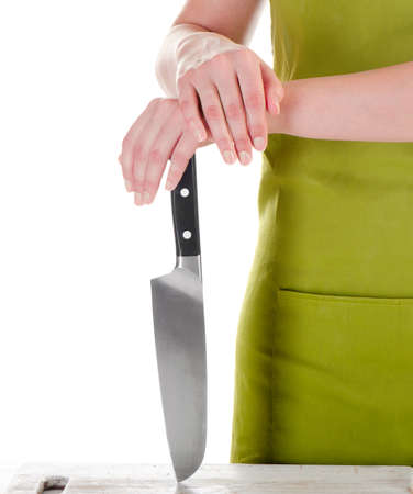 Chef  with a  knife isolated on a white backgroundの写真素材