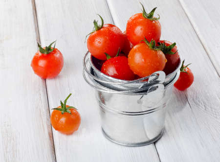 Fresh  cherry tomatoes  on a wooden table. Selective focusの写真素材