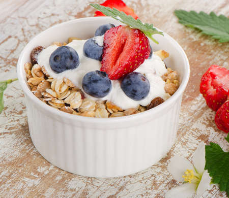 Muesli and yogurt with fresh berries. Selective focus