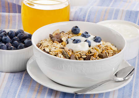 Healthy breakfast - muesli , yogurt and  juice . Selective focusの写真素材