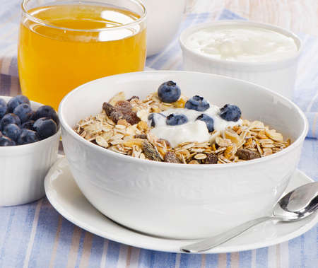 Healthy breakfast - muesli , yogurt and  juice . Selective focusの写真素材