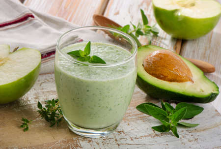 Green  smoothie on a wooden table. Selective focusの写真素材