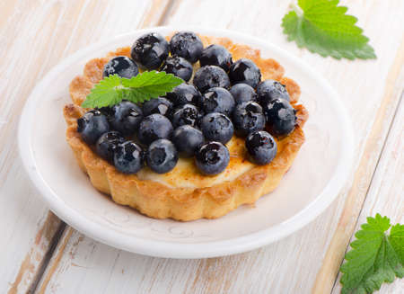 Fresh Blueberry tart on a white plate. Selective focusの写真素材
