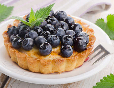 Fresh Blueberry tart on a white plate. Selective focusの写真素材