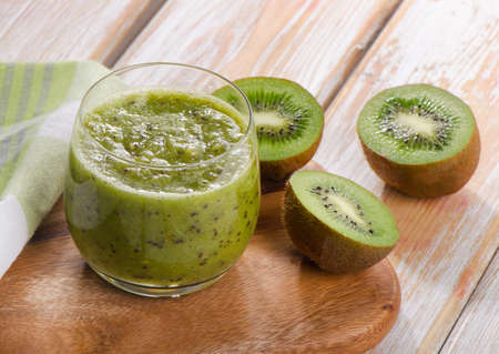 Healthy kiwi smoothie in a glass. Selective focusの写真素材