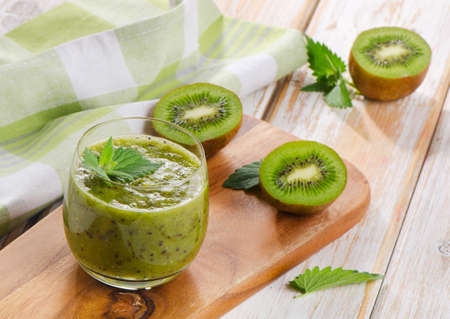 Healthy kiwi smoothie in a glass. Selective focusの写真素材