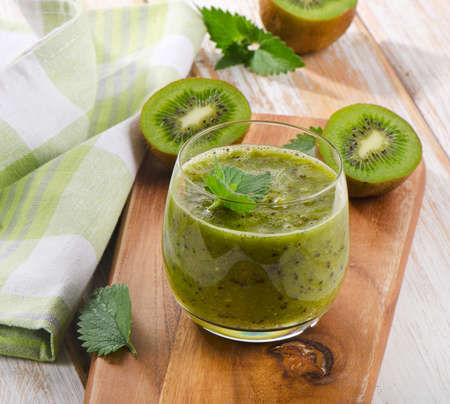 Healthy kiwi smoothie in a glass. Selective focusの写真素材