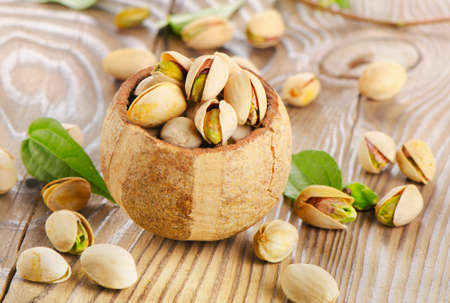 Pistachios on a wooden table. Selective focusの写真素材