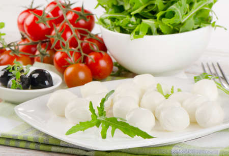 Healthy italian food - cheese with fresh vegetables. Selective focusの写真素材