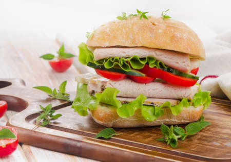 Fresh healthy sandwich  on a wooden cutting board. Selective focusの写真素材