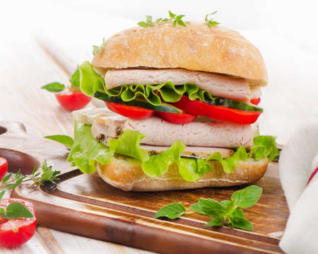 Fresh healthy sandwich  on a wooden cutting board. Selective focusの写真素材