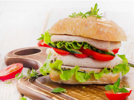 Fresh healthy sandwich  on a wooden cutting board. Selective focusの写真素材