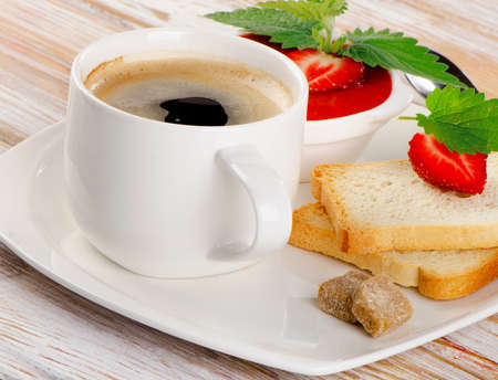 Breakfast with toast, strawberry jam and hot coffee. Selective focusの写真素材