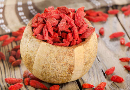 Red goji berries on wooden table  Selective focusの写真素材