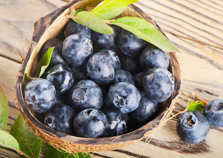 Fresh blueberries on a wooden background  Selective focusの写真素材
