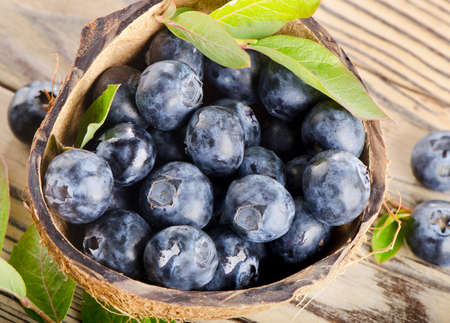 Fresh blueberries on a wooden background  Selective focusの写真素材