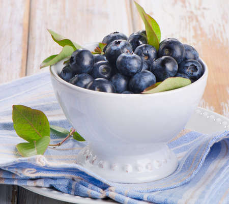 Fresh blueberries in a white bowl  Selective focusの写真素材
