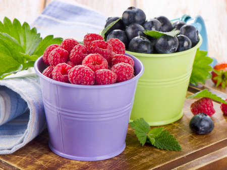 Fresh berries on a wooden board . selective focusの写真素材