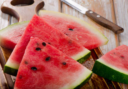 slices of watermelon on wooden table. selective focusの写真素材