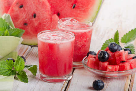 Watermelon smoothie on a wooden table. Selective focusの写真素材
