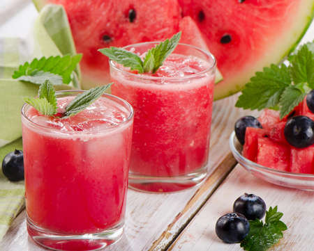 Watermelon smoothie on a wooden table. Selective focusの写真素材