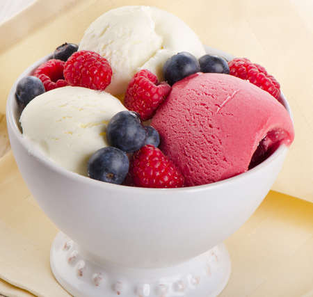 Ice cream with  fresh berries. Selective focusの写真素材