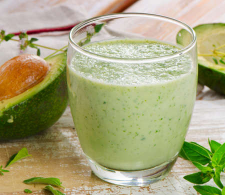 Green  smoothie on a wooden table. Selective focusの写真素材