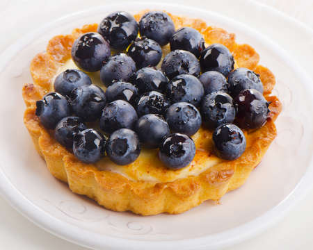 Fresh Blueberry tart on a white plate. Selective focusの写真素材
