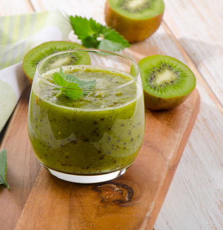 Green  smoothie on a wooden table. Selective focusの写真素材