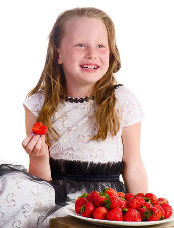 Cute little girl with  strawberry isolated on  a white backgroundの写真素材