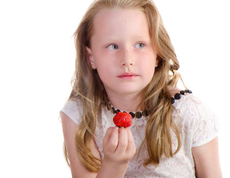 Cute little girl with  strawberry isolated on  a white backgroundの写真素材
