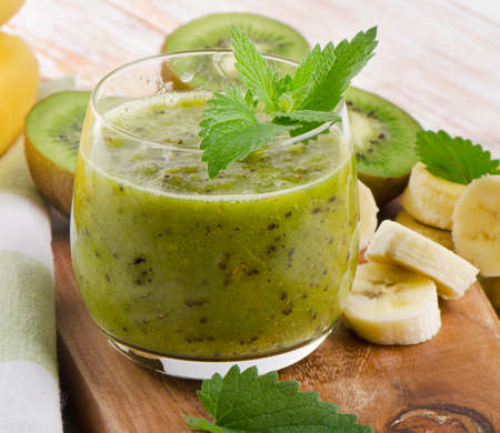 Green  smoothie on a wooden table. Selective focusの写真素材