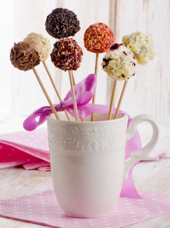 Cake pops in a white cup . Selective focusの写真素材