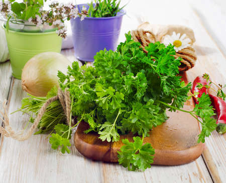 Fresh parsley on a wooden table. Selective focusの写真素材