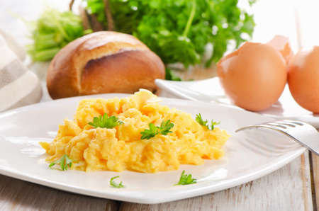 Scrambled eggs with fresh herbs. Selective focusの写真素材