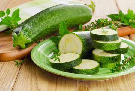 Fresh green zucchini  with herbs. Selective focusの写真素材