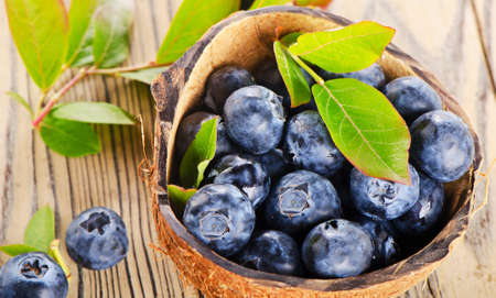 Fresh blueberries on a wooden background. Selective focusの写真素材