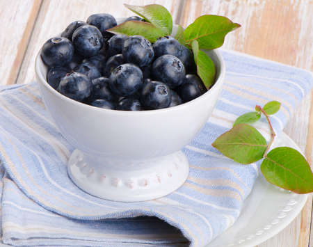 Fresh blueberries on a wooden background. Selective focusの写真素材
