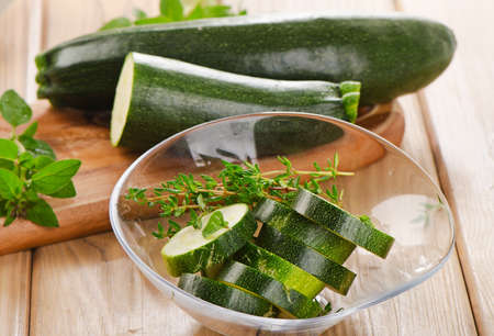 Fresh zucchini on a wooden  cutting board. Selective focusの写真素材