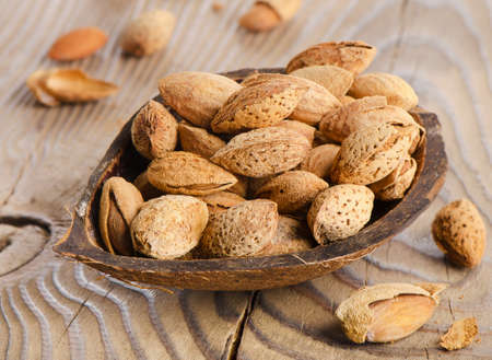 Almonds  on a wooden table. Selective focusの写真素材