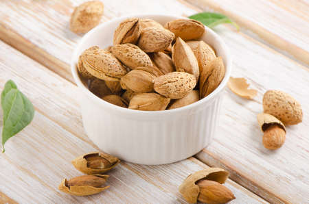 Almond nuts on wooden table. Selective focusの写真素材